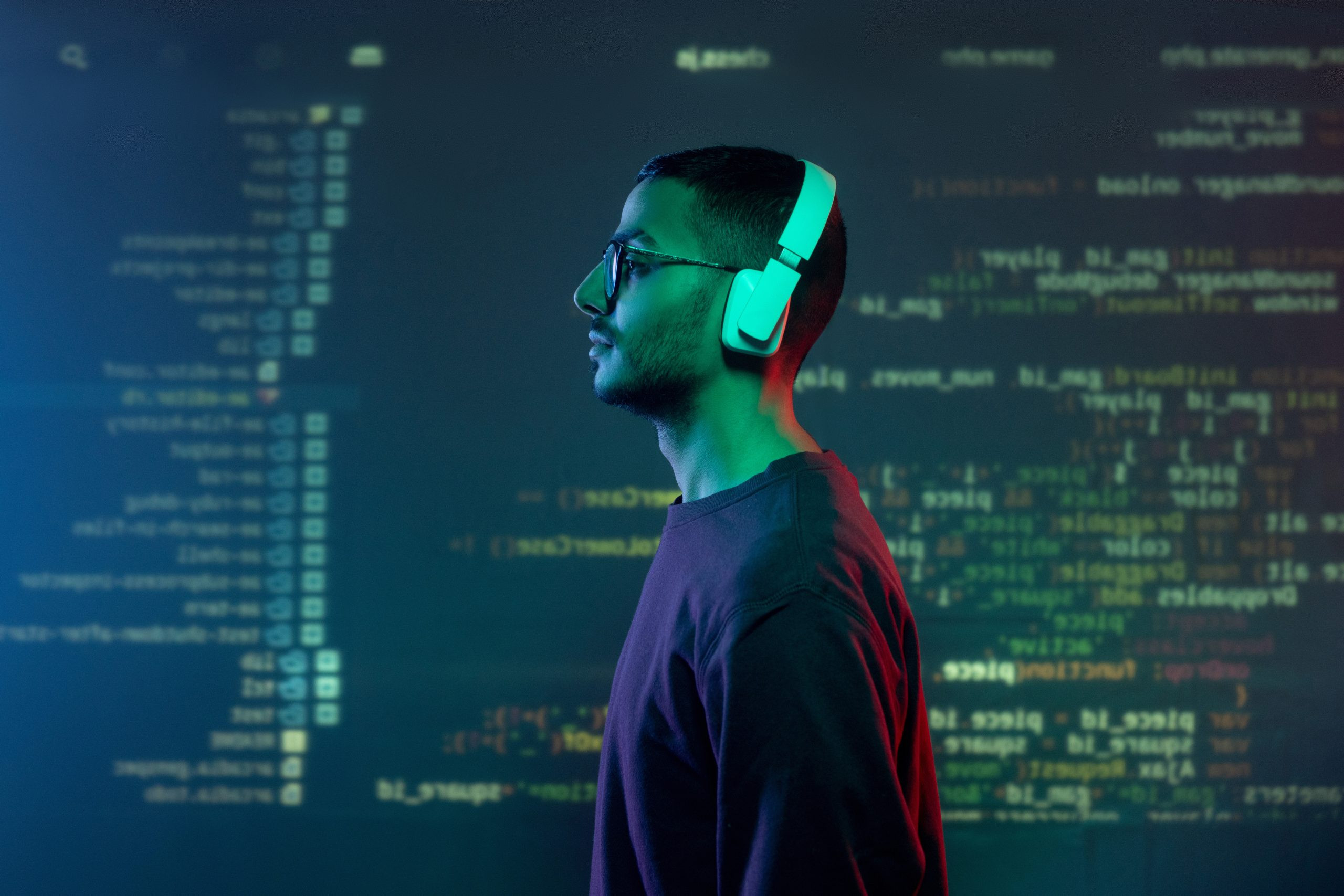 Man with headphones on seemingly inside an AI computer